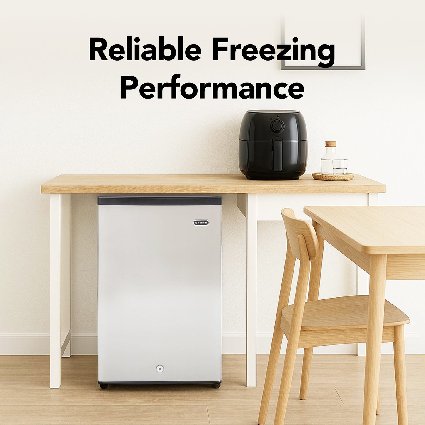 CUF-210SS Small refrigerator next to a dining table with a black appliance on it, labeled 'Reliable Freezing Performance'.