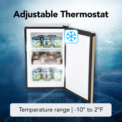 CUF‑210SSG Small freezer with open door showing ice cream containers on a blue textured background, labeled 'Adjustable Thermostat' and 'Temperature range: -10° to 2°F'.